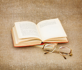 Image showing Still-life from eyeglasses and book