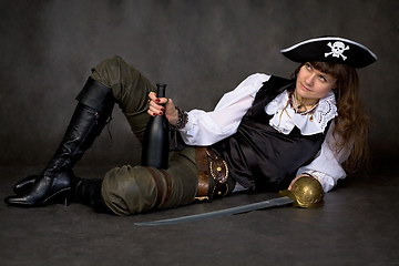 Image showing Girl - pirate with sabre and bottle