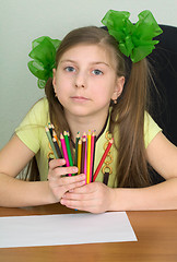 Image showing Girl with color pencils in hands