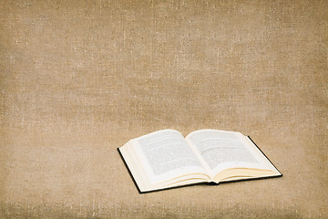 Image showing Opened book on canvas background