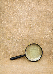 Image showing Magnifying glass on the sacking