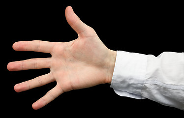 Image showing Hand with a white sleeve on  black