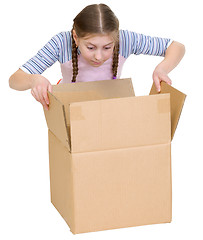 Image showing Girl glance at cardboard box