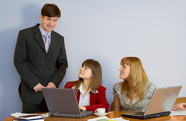 Image showing Girls at a desktop and their chief