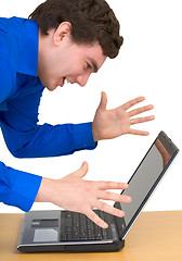 Image showing Young man and laptop