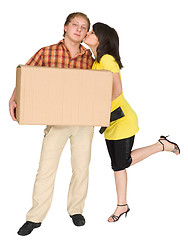 Image showing Girl kisses the guy holding a box