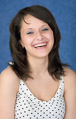 Image showing Laughing, happy girl on a blue background
