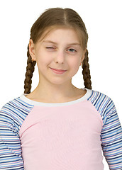 Image showing Young girl wink at us