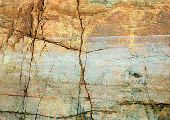 Image showing Cracked rock on seacoast backdrop