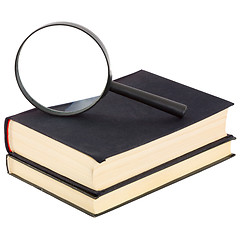 Image showing Still-life from a magnifier and a pile of old books