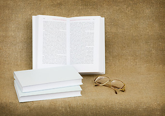 Image showing Still-life from eyeglasses and books