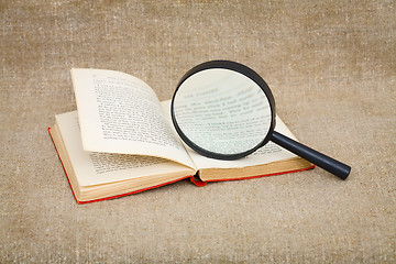 Image showing Still-life from a magnifier and book