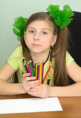 Image showing Girl with color pencils in hands