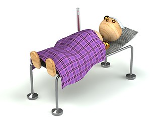 Image showing Wood man with flue in the bed