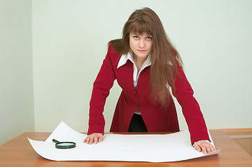 Image showing Business woman was inclined over the plan