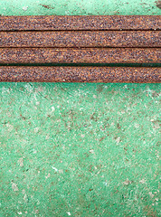 Image showing Old concrete painted wall with rusty pipes