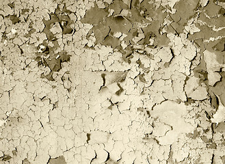 Image showing old damaged paint on a concrete wall - sepia