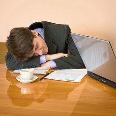 Image showing Businessman has fallen asleep sitting at meeting