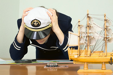 Image showing Depressed girl in a sea uniform