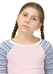 Image showing Little girl in a T-shirt on a white background