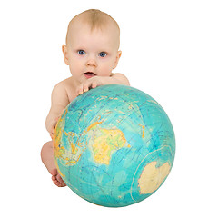 Image showing Baby with geographical globe isolated on white