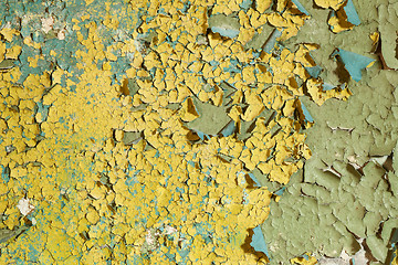 Image showing Old damaged yellow paint on a concrete wall