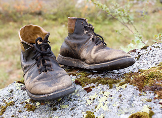 Image showing Old torn leather boots