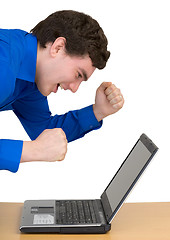 Image showing Emotional young man with the laptop