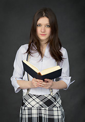 Image showing Portrait of the schoolgirl reading the book