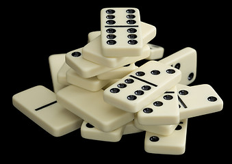 Image showing Heap of dominoes on a black background