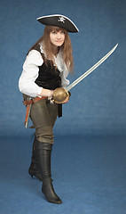 Image showing Pirate girl with sword rush to the attack on blue