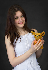 Image showing Teenager hold a toy - the doggie