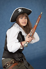 Image showing Frightened pirate girl - with pistol