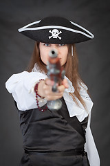 Image showing Pirate woman with old pistol