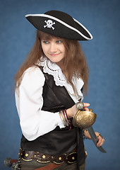 Image showing Beautiful girl - pirate on blue background