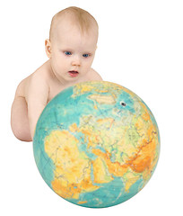 Image showing Baby with geographical globe isolated on white