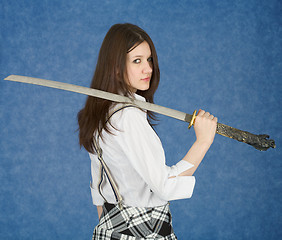 Image showing Young woman with the Japanese sword in a hand