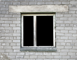 Image showing Dark window of the thrown old building