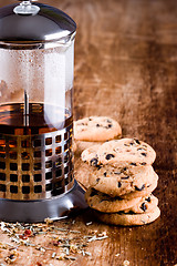 Image showing french press with hot tea and fresh baked cookies