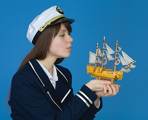 Image showing Girl blowing on sails of the ship