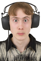 Image showing Amusing young man in ear-phones with protruding eyes