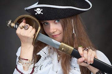 Image showing Girl in pirate hat with a sabre in hands