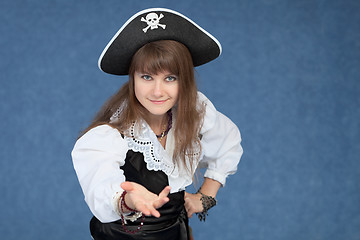 Image showing Affable sexy girl in suit of the sea medieval pirate on blue