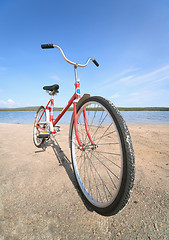 Image showing Old red bicycle photographed on beach