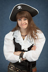 Image showing Young beautiful girl the pirate pulls faces