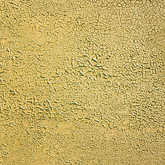 Image showing Painted peeled concrete yellow wall