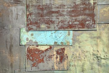 Image showing Wall covered with sheets of rusty old iron background