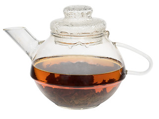 Image showing Transparent glass teapot with tea on white background