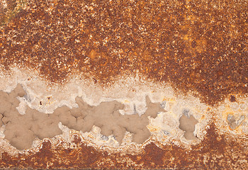 Image showing Rusty iron with peeled paint and corrosion stains background