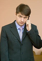 Image showing Man speaks by a mobile phone